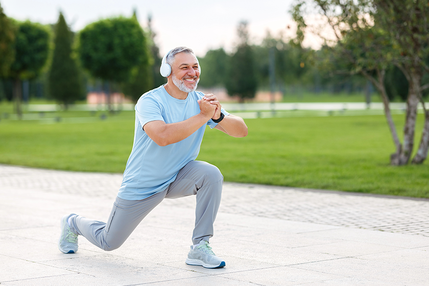 Full-length photo of happy smiling retired sportsman