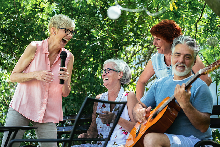 group elderly people enjoying retirement going picnic