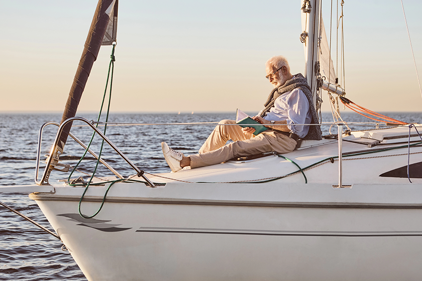 Relaxed senior man reading a book